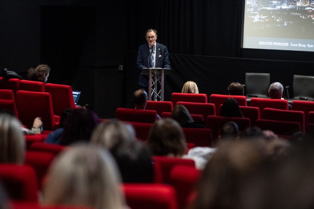 Vice-Chancellor Professor Sir Ian Greer addressing gathered staff, students and guests at the screening of 'Delivering the Impossible: Agreement Twenty Five' documentary