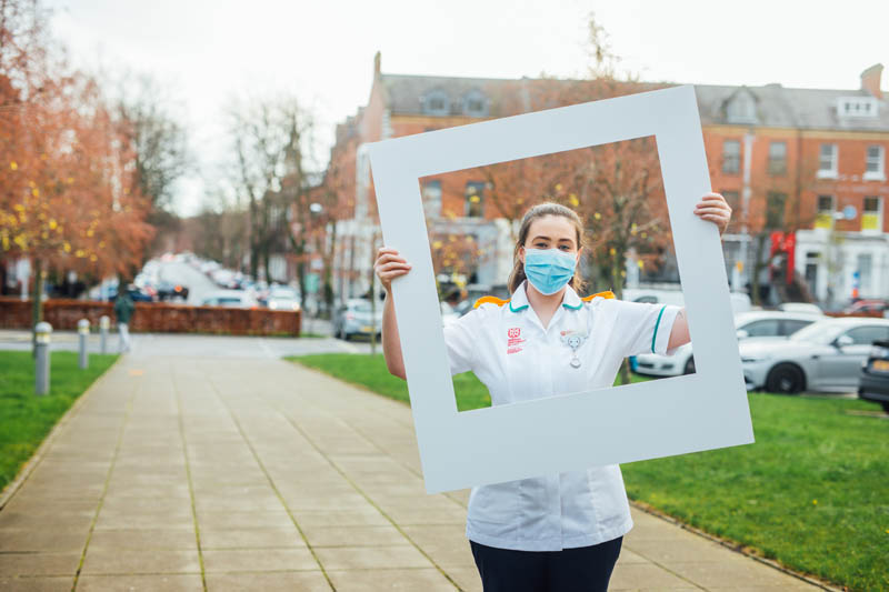 Image of Laura outside MBC with Elmwood Avenue in her background 