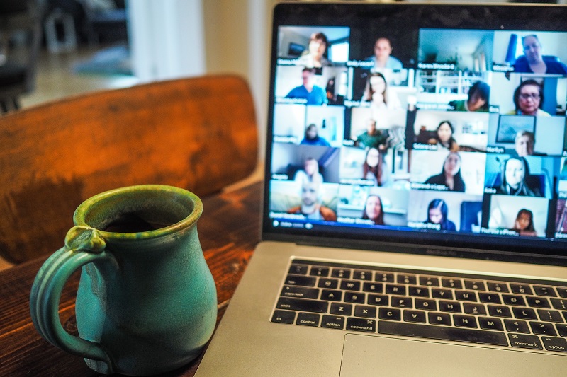 working from home - Zoom meeting on laptop - with coffee mug