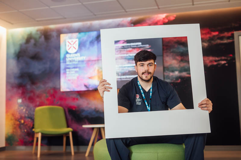 Image of medical student in InterSim Centre with large polaroid frame