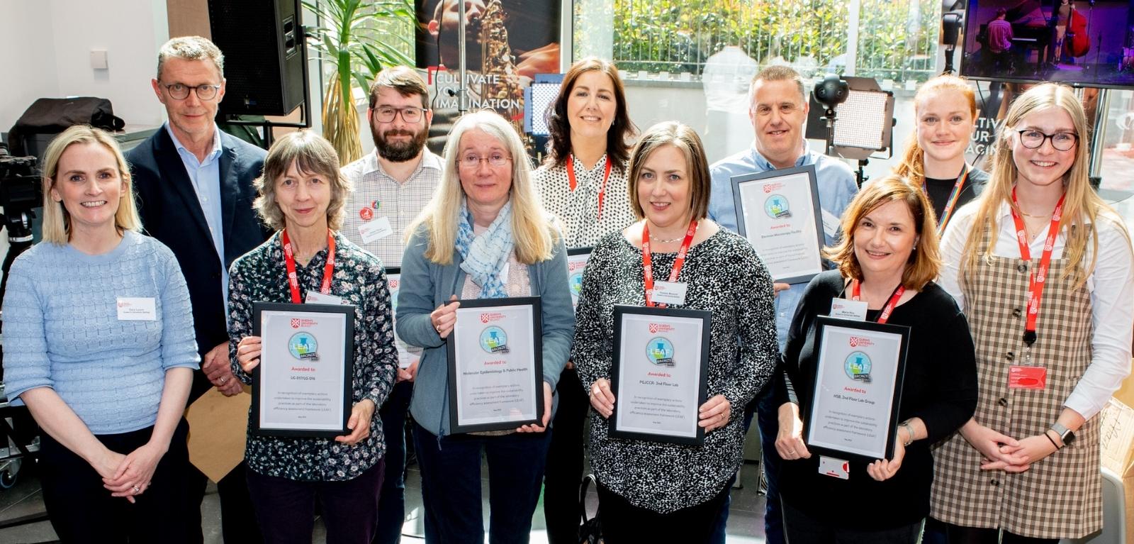 Lab representatives holding their Bronze Award Certificates