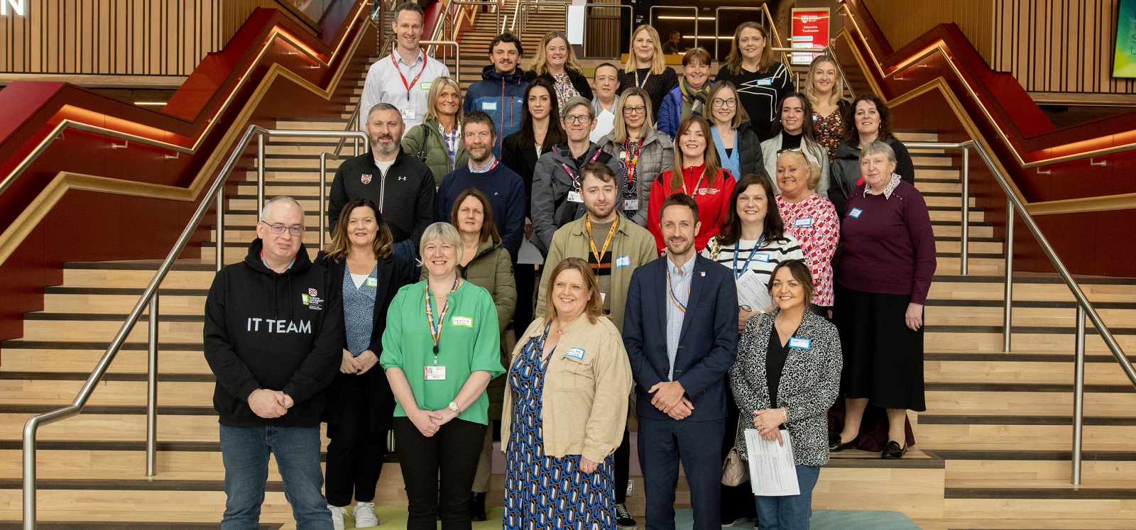 group of Queen's staff and representatives from support organisations and external partners of the Inclusive Employment Scheme