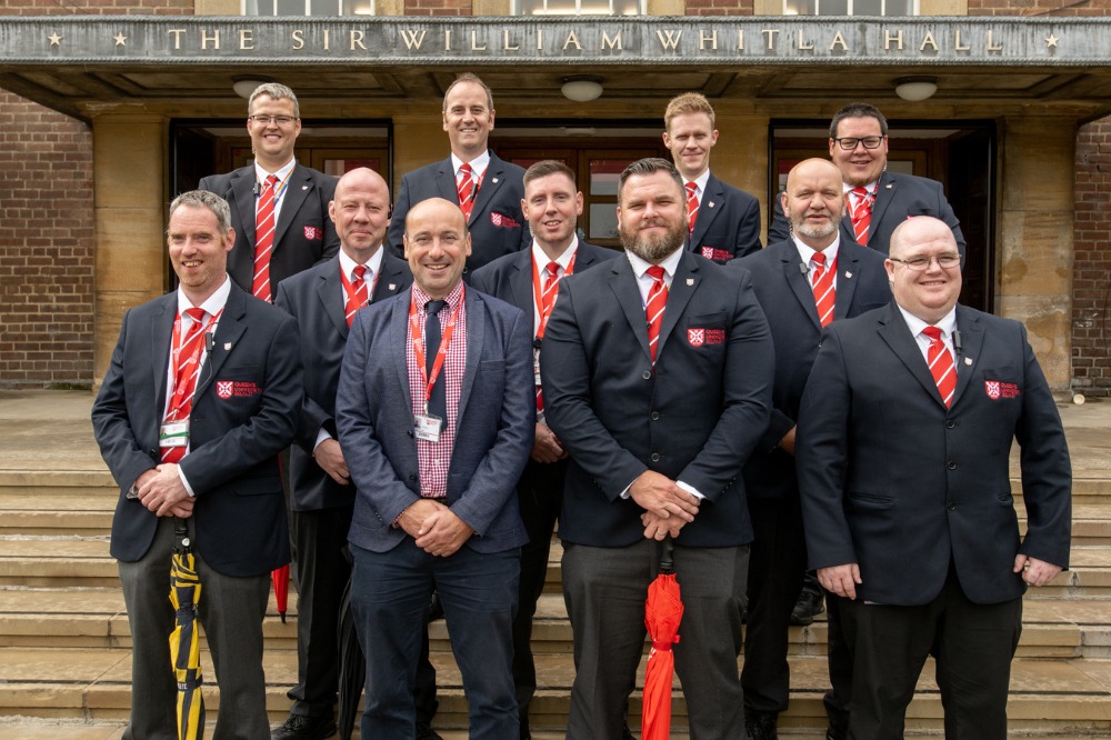 Queen's Security Team pose outside the Whitla Hall