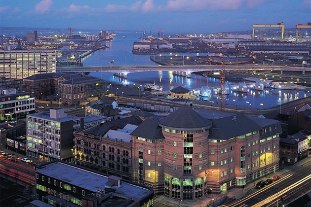 night time view over Belfast with Harland and Wolff cranes and Belfast Lough in the background