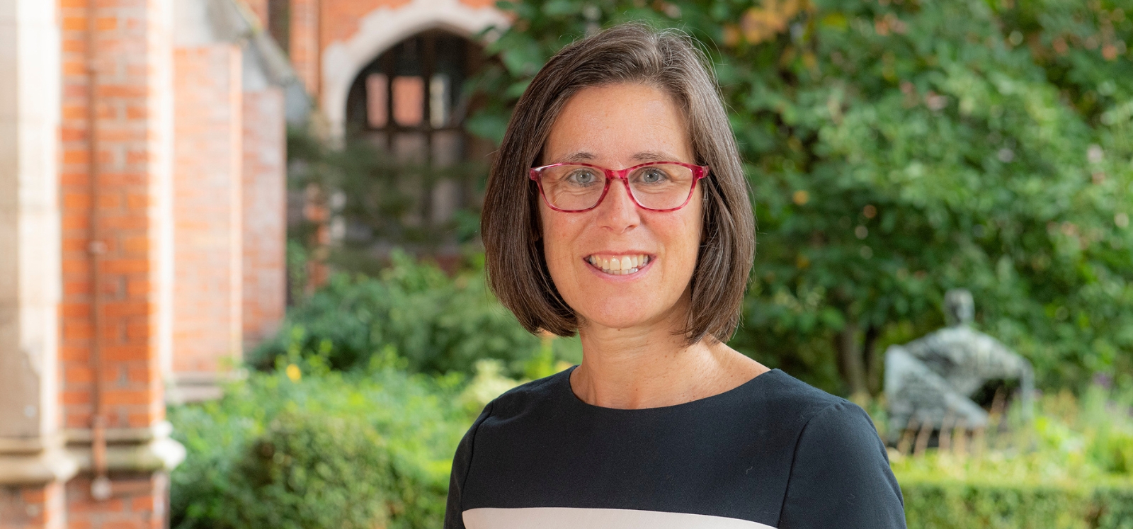 Professor Judy Williams pictured under the clocktower in Queen's University Belfast quadrangle