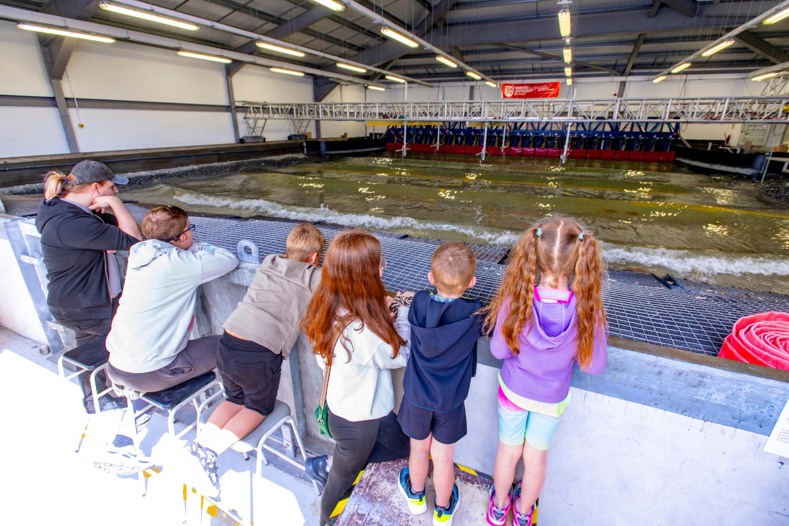 members of the public looking at the wave tank at the Queen's University Belfast Marine Laboratory Open Day 2024